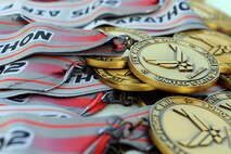 The 386th Expeditionary Force Support Squadron hosted the Air Force Marathon at a deployed location in Southwest Asia, Sept. 19, 2015. Race participants received medals after completing half marathon and 10K races. (U.S. Air Force photo/Tech. Sgt. Brittany E. Jones)