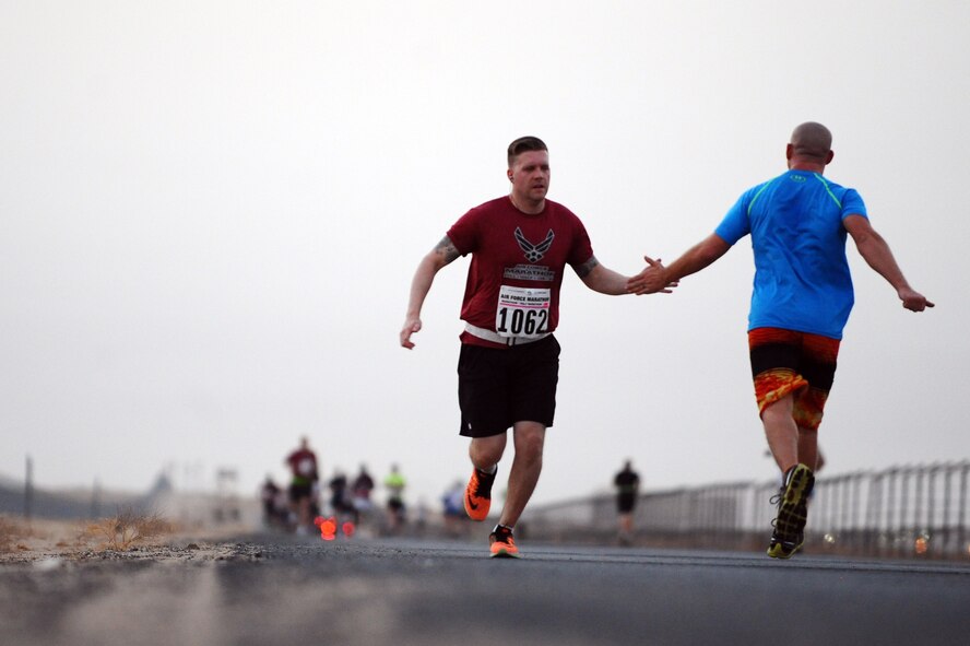 Runners deployed in support of Operation Inherent Resolve participate in the Air Force Half Marathon at a deployed location in Southwest Asia, Sept. 19, 2015. This is the seventh year the U.S. Air Force has sanctioned deployed location races overseas. (U.S. Air Force photo/Tech Sgt. Brittany E. Jones)