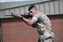 Cpl. Mohamad A. Jrad scans the area during military operations on urban terrain training at Marine Corps Air Station Cherry Point, N.C., Sept. 16, 2015. MOUT training is utilized to prepare Marines for urban warfare in areas such as towns and cities. 2nd Low Altitude Air Defense Battalion, Bravo Battery Marines conducted the training to sharpen combat skills and ensure the knowledge required for MOUT operations is equal across the entire platoon. Jrad is a low altitude air defense gunner with 2nd LAAD.