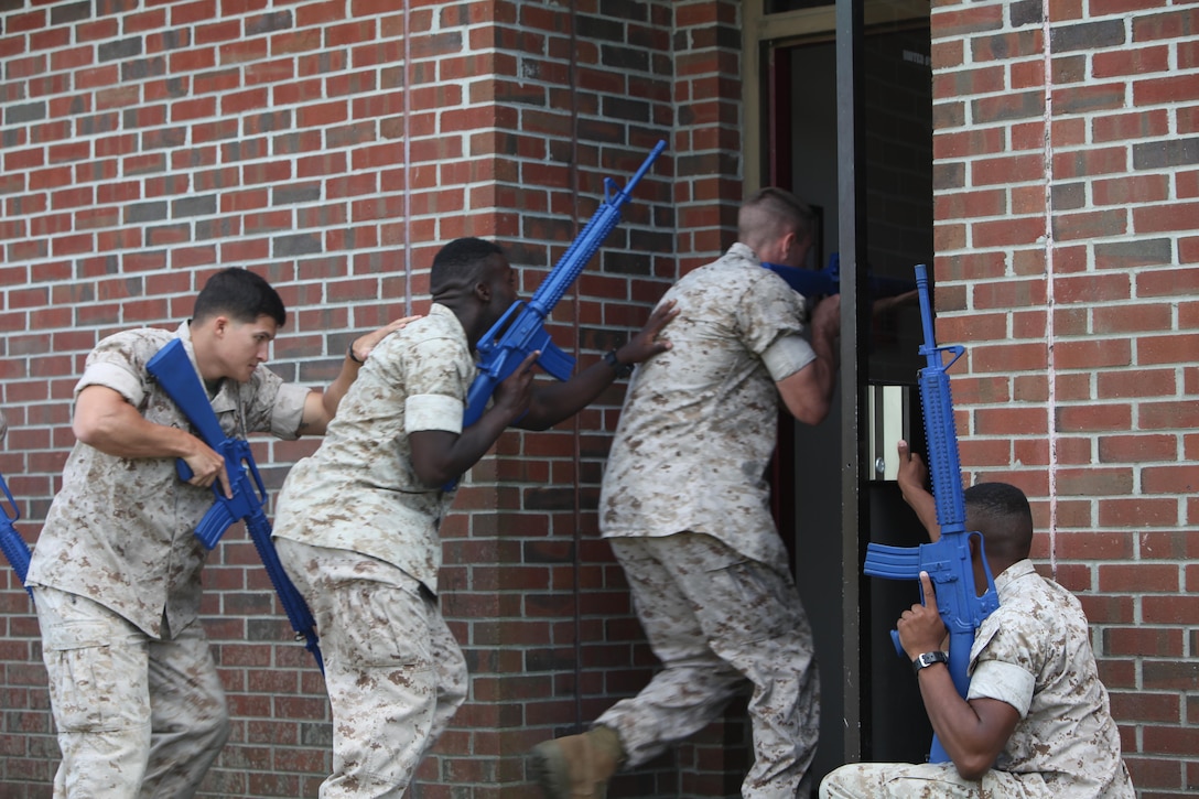 Marines with 2nd Low Altitude Air Defense Battalion, Bravo Battery tactically enter a building during military operations on urban terrain training at Marine Corps Air Station Cherry Point, N.C., Sept. 16, 2015. MOUT training is utilized to prepare Marines for urban warfare in areas such as towns and cities. The Marines conducted the training to sharpen combat skills and the knowledge required for MOUT operations is equal across the entire platoon. 