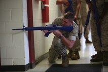 Lance Cpl. Matthew Ford scans a passageway during military operations on urban terrain training at Marine Corps Air Station Cherry Point, N.C., Sept. 16, 2015. MOUT training is utilized to prepare Marines for urban warfare in areas such as towns and cities. 2nd Low Altitude Air Defense Battalion, Bravo Battery Marines conducted the training to sharpen combat skills and ensure the knowledge required for MOUT operations is equal across the entire platoon. Ford is a low altitude air defense gunner with 2nd LAAD.