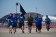 Marine Corps (Ret.) GySgt Ryan Rivera and members of Air Force Sergeants Association Chapter 102, run the POW/MIA flag to the show center to mark the start of the 2015 Joint Base Andrews Airshow, Sept. 18. (U.S. Air Force photo/Staff Sgt. Nichelle Anderson/Released)