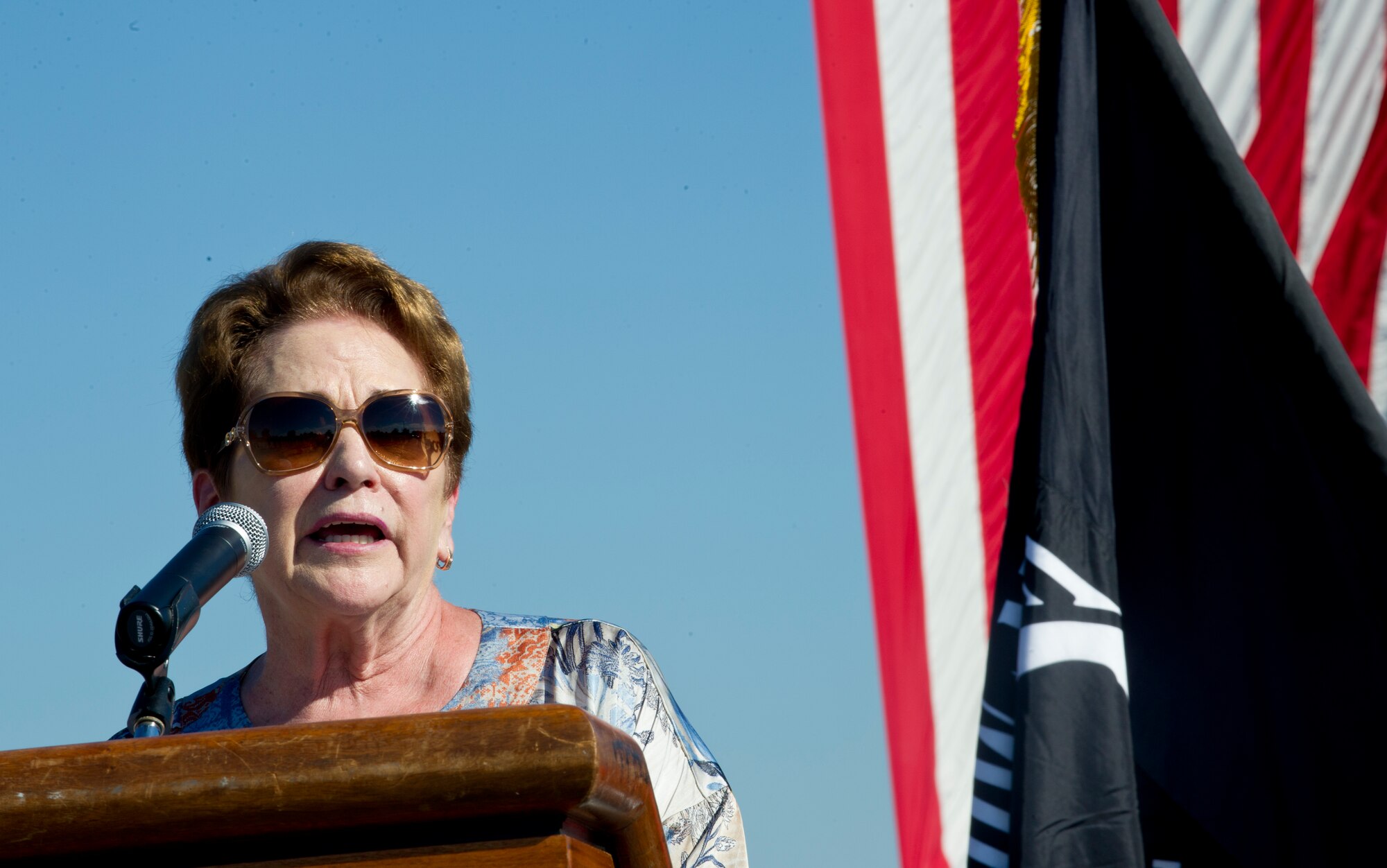 Ann Mills-Griffiths, CEO and Chairman of the Board of Directors for the National League of POW/MIA Families, speaks during the opening ceremony for the POW/MIA 24-hour Remembrance Run. During the entirety of the event, members carried the POW/MIA flag around the course. The intent was for the flag to stay in motion at all times, signifying the constant search for all POW/MIA.  (U.S. Air Force photo/Staff Sgt. Nichelle Anderson/Released)