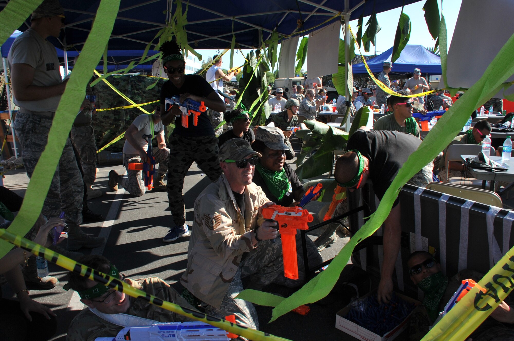 “CODE RED!” Mayhem and hilarity ensue as a mock firefight breaks out with members of the Global Positioning Directorate defending their tent  during the Space and Missile Systems Center Combat Dining-Out at Los Angeles Air Force Base in El Segundo, Calif. (U.S. Air Force photo/Sarah Corrice)