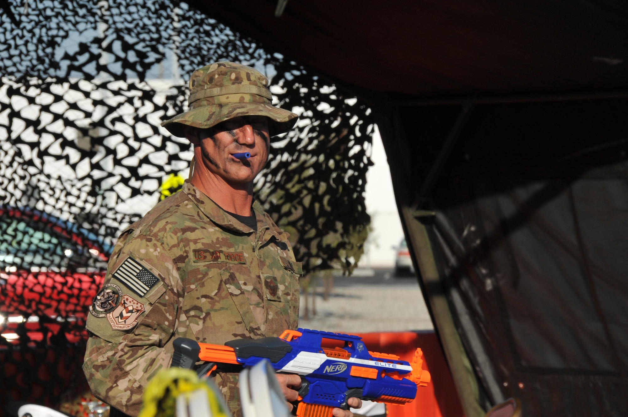 Chief Master Sgt. Craig Hall, Space and Missile Systems Center command chief, channels his inner Clint Eastwood rendition of Gunnery Sgt. Tom Highway from Heartbreak Ridge as he surveys the obstacle course at the SMC Combat Dining-Out at Los Angeles Air Force Base in El Segundo, Calif. (U.S. Air Force photo/Sarah Corrice)