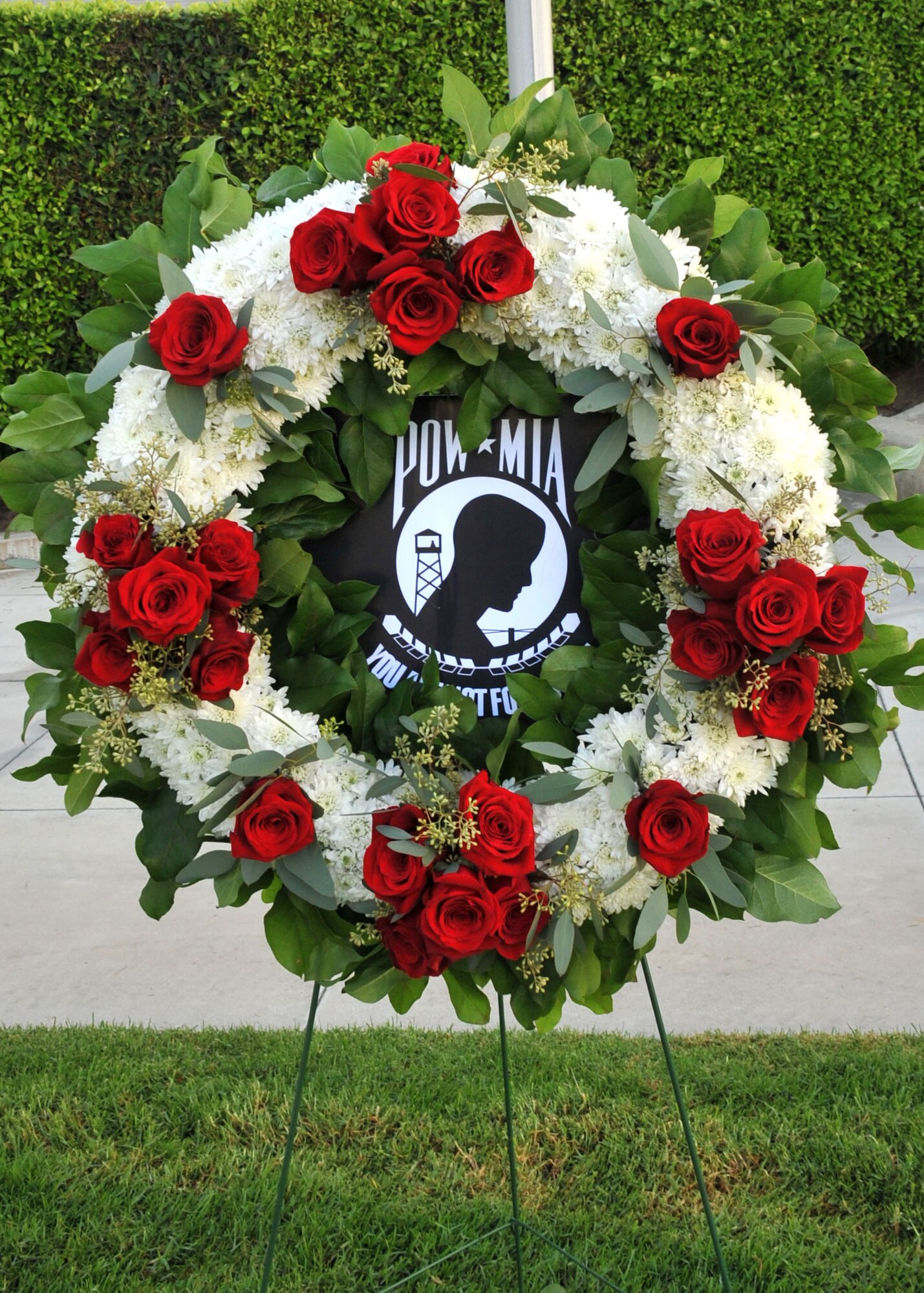 A commemorative POW/MIA wreath stands in repose awaiting the start of the National POW/MIA Recognition Day at the Space and Missile Systems Center's Schriever Space Complex flagpole at Los Angeles Air Force Base in El Segundo, Calif. (U.S. Air Force photo/Sarah Corrice)