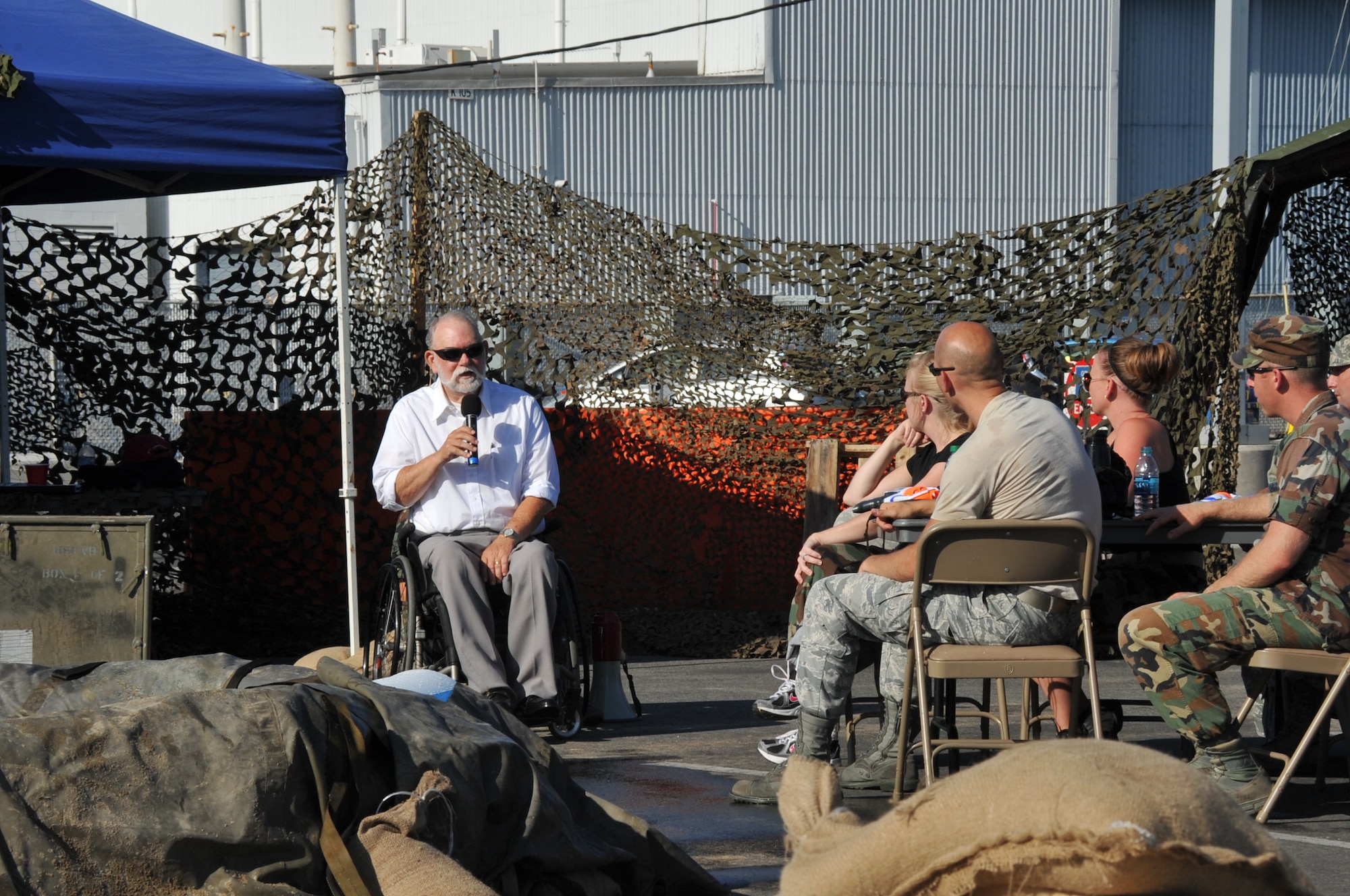 Guest speaker and retired Army 1st Lt. George Gentry, a Vietnam veteran, addresses the Warriors of the Mess during the Space and Missile Systems Center Dining Out held at Los Angeles Air Force Base in El Segundo, Calif. Gentry singled out and expressed his thanks and admiration to members of the Air Force Medical Service responsible for stabilizing him and performing an aeromedical evacuation out of the theatre of conflict, thereby saving his life. (U.S. Air Force photo/Sarah Corrice)