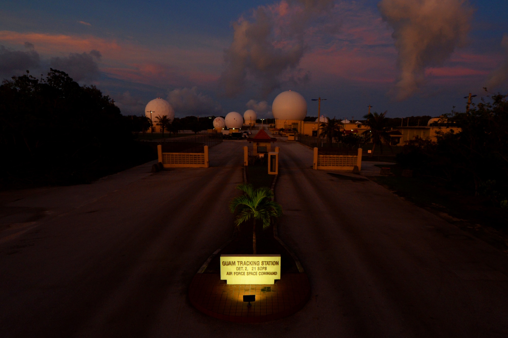 The sun sets on the 21st Space Operations Squadron Detachment 2 tracking station Sept. 15, 2015, at Northwest Field on Andersen Air Force Base, Guam. The 21st SOPS Det 2 celebrated its 50th anniversary with a ceremony here Sept. 17, 2015.(U.S. Air Force photo by Airman 1st Class Alexa Ann Henderson/Released)