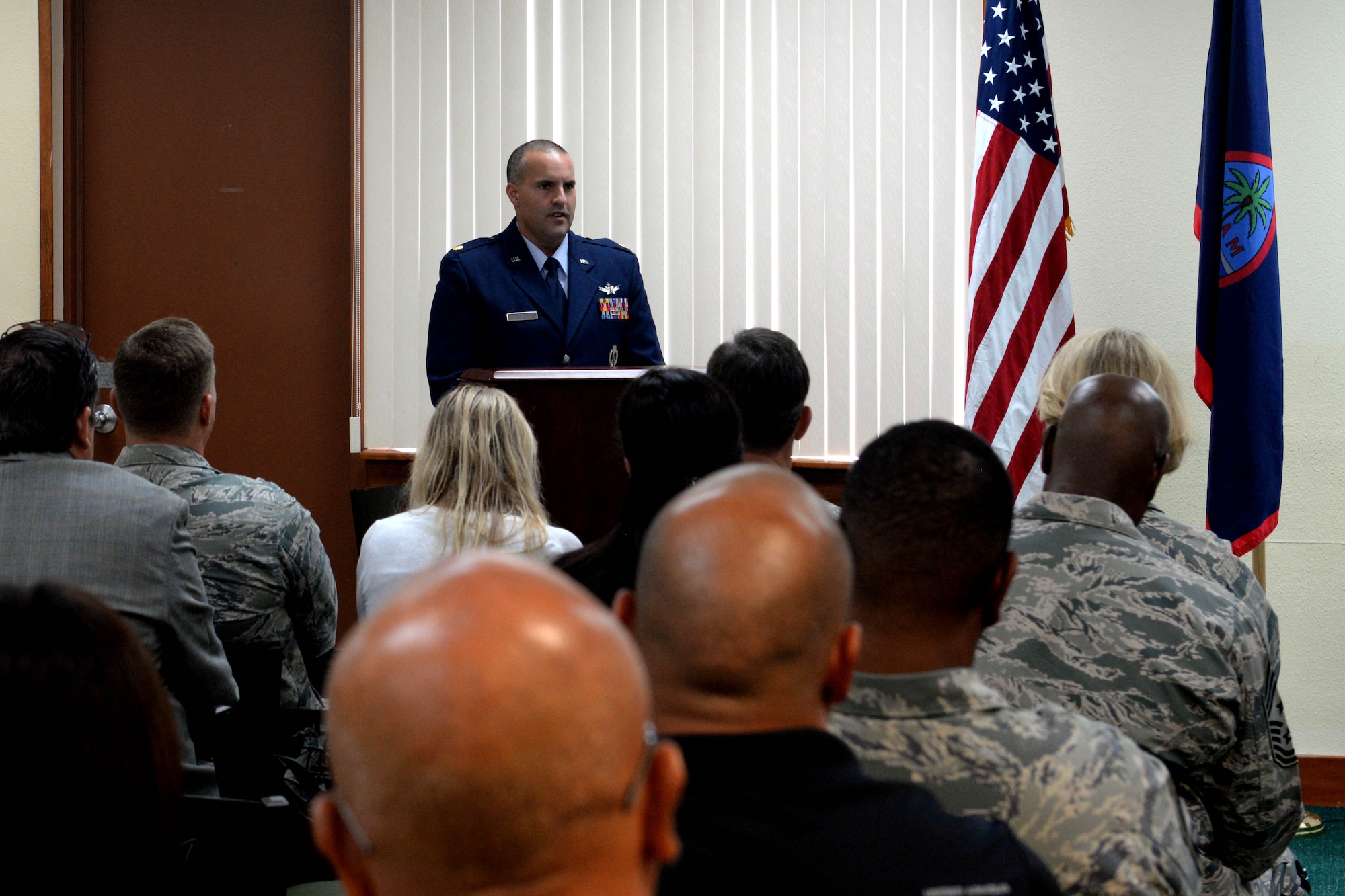 Maj. Christopher Butler, 21st Space Operations Squadron Detachment 2 commander, speaks to an audience Sept. 17, 2015 at Northwest Field on Andersen Air Force Base, Guam. The 21st SOPS Det 2 celebrated their 50th anniversary with a ceremony here Sept. 17, 2015. (U.S. Air Force photo by Airman 1st Class Alexa Ann Henderson/Released)