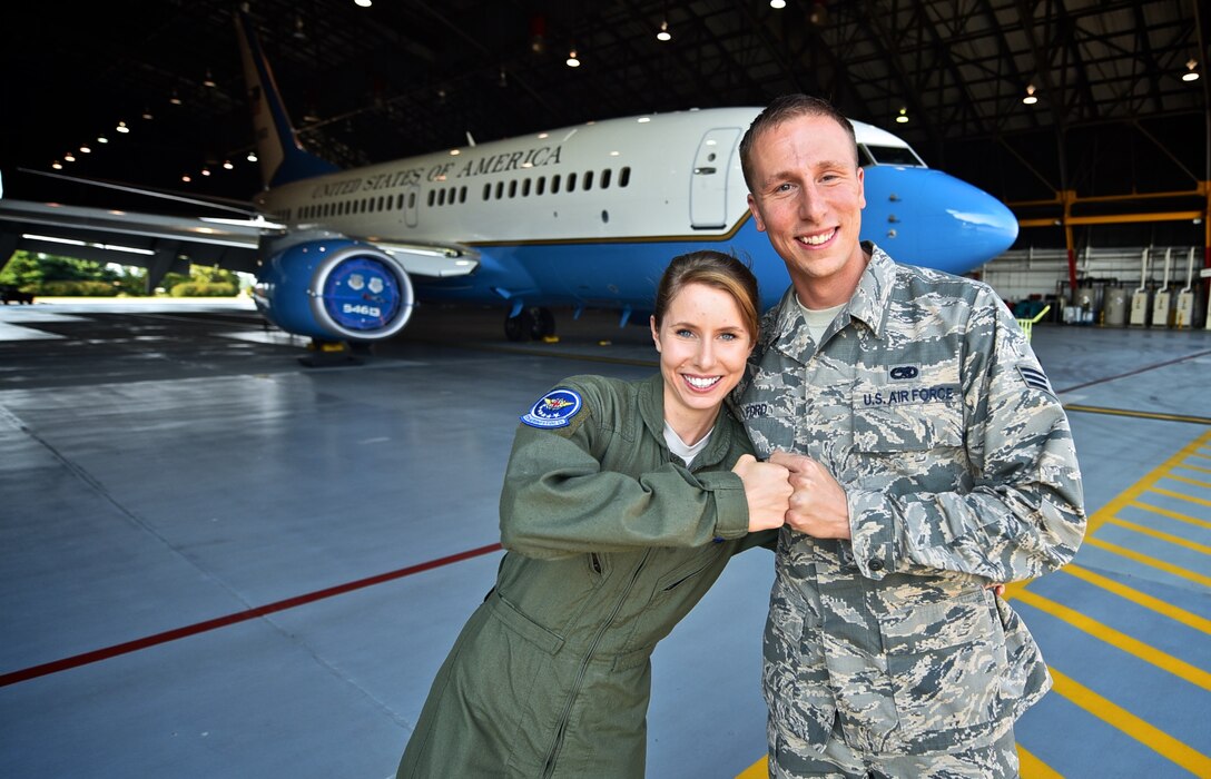 Staff Sgt. Marie Carroll, 932nd Aeromedical Evacuation Squadron medical technician, bumps fists with her brother Senior Airman Damien Ford from the 932nd Maintenance Squadron inside Hangar 1 at Scott Air Force Base, Illinois, Aug. 14, 2015. The siblings were interviewed as part of a video highlighting family members assigned to the 932nd Airlift Wing.  (U.S. Air Force photo by Christopher Parr)