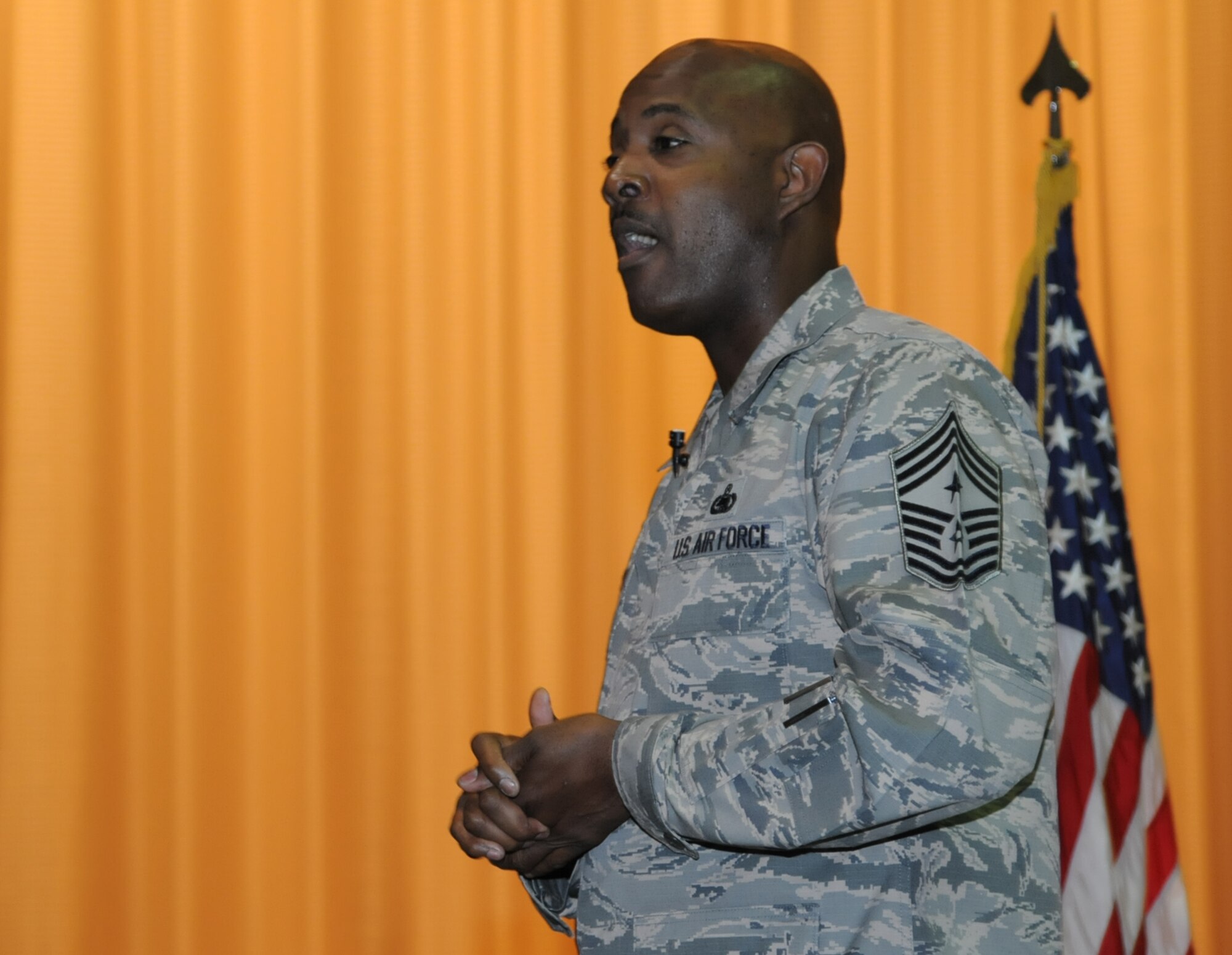 Chief Master Sgt. Cameron Kirksey, Air Force Reserve Command chief, speaks with members of the 927th Air Refueling Wing during commanders call held here on Sept. 20, 2015. Kirksey was touring the base to view different squadrons and speak with members of the wing. 