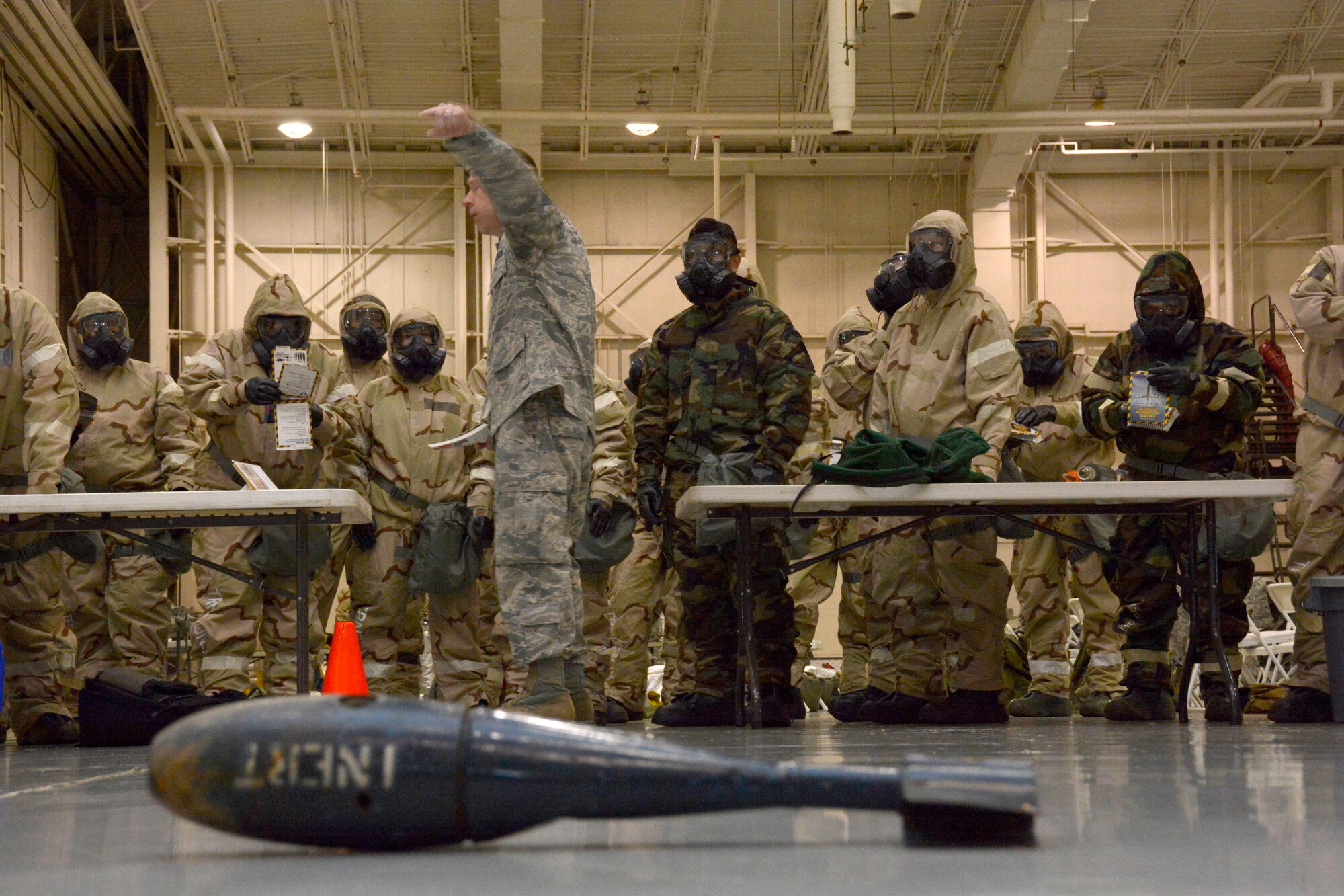 U.S. Air Force Staff Sgt. Ronald Hardison, a member of the 145th Airlift Wing, Emergency Management team, gives a hands-on demonstration of a post attack reconnaissance team’s mission with unexploded ordinances during the Air Expeditionary Skills Rodeo, held Sept. 13, 2015, in a hangar at the North Carolina Air National Guard Base, Charlotte Douglas International Airport. A par team’s main objectives are to identify UXOs, chemical agent detection and self-aid and buddy care. (U.S. Air National Guard photo by Senior Airman Laura Montgomery, 145th Public Affairs/Released)