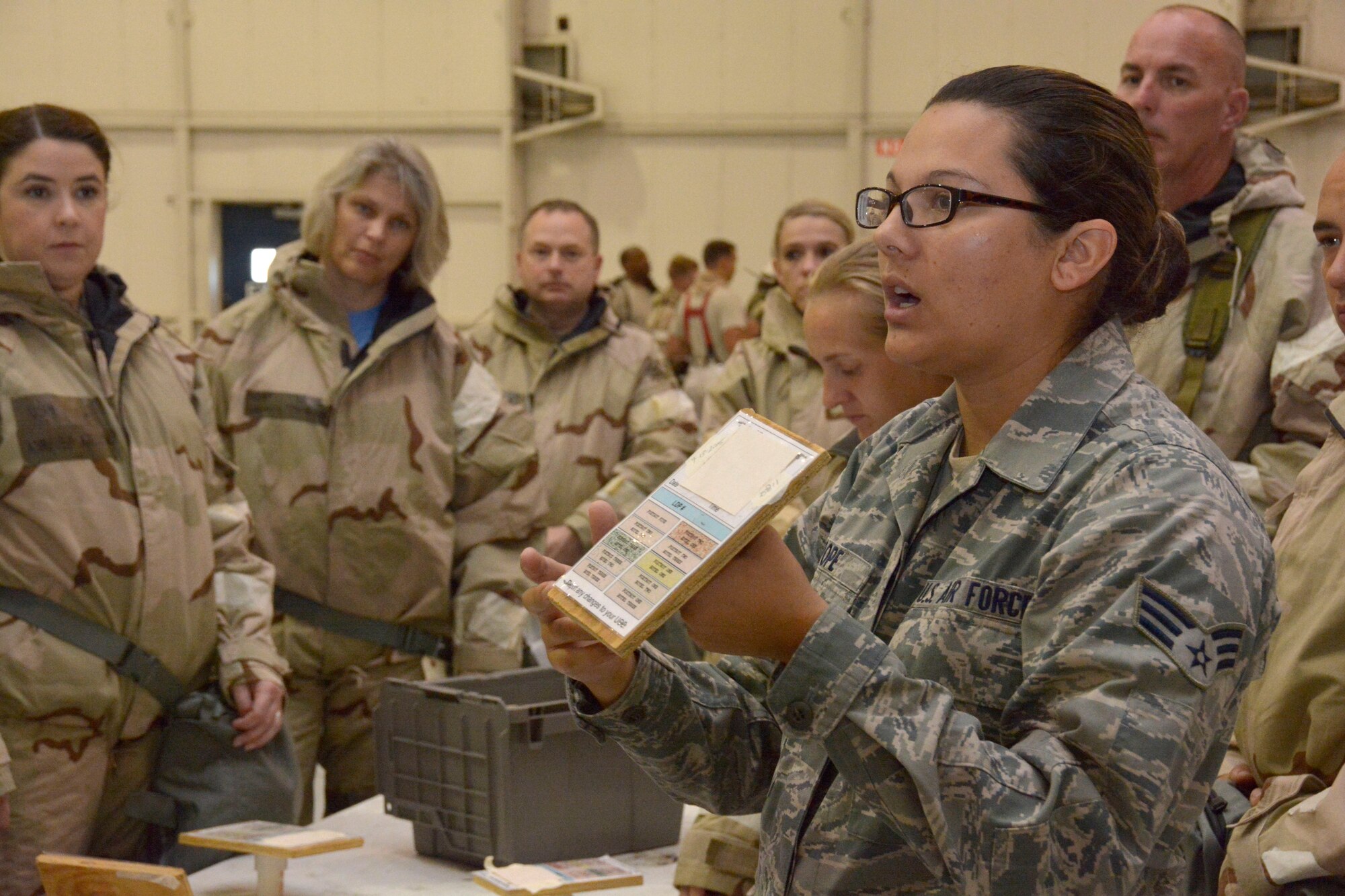U.S. Air Force Cori Pope, a member of the 145th Airlift Wing, Emergency Management team, gives a hands-on demonstration of special m-8 and 9 chemical detection papers during the Air Expeditionary Skills Rodeo, held Sept. 13, 2015 in a hangar at the North Carolina Air National Guard Base, Charlotte Douglas International Airport. The detection paper alerts members to any fallen and still lingering chemicals that may be in the area during and after a chemical attack. (U.S. Air National Guard photo by Senior Airman Laura Montgomery, 145th Public Affairs/Released)