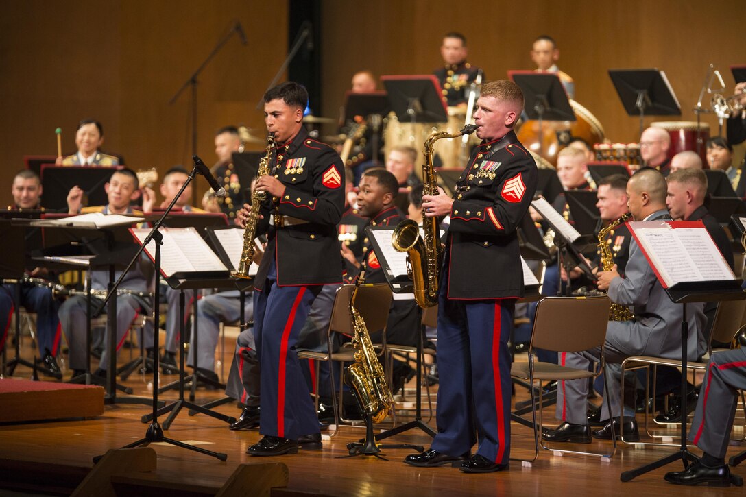U.S. Marine Cpl. Nassim Amirouche, left, and U.S. Marine Sgt. Michael Parker play a duet during the 20th Annual Combined Band Concert, at Okinawa Civic Hall, in Okinawa City, Okinawa, Japan, Sept. 19, 2015. The concert celebrated the long-standing relationship between the Marine and Japan Ground Self Defense Force musical ensembles, affording them the opportunity to once again combine forces and musically stimulate an audience. Amirouche, from Stratford, Connecticut, and Parker, from Cazenovia, New York, are saxophonist with the III Marine Expeditionary Force Band, III Marine Expeditionary Force Headquarters Group.