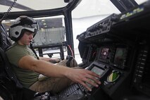U.S. Marine Corps Cpl. Austin A. Meekins, a tiltrotor crew chief with Marine Medium Tiltrotor Squadron (VMM) 365, conducts pre-flight checks on an MV-22B Osprey before parachute exercises at Marine Corps Air Station New River, N.C., Sept. 1, 2015. VMM-365 transported Marines assigned to Marine Raider Regiment as they conducted the exercises.
