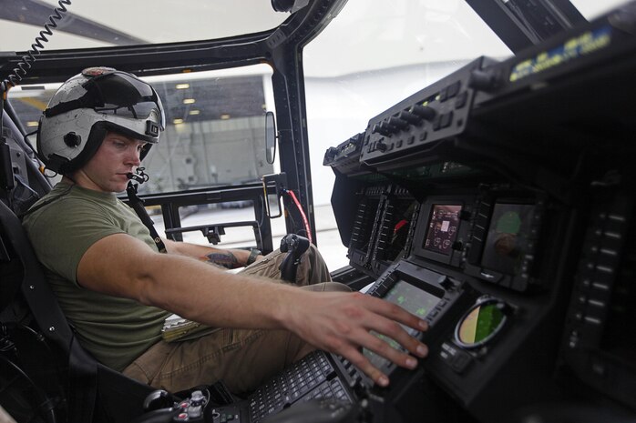 U.S. Marine Corps Cpl. Austin A. Meekins, a tiltrotor crew chief with Marine Medium Tiltrotor Squadron (VMM) 365, conducts pre-flight checks on an MV-22B Osprey before parachute exercises at Marine Corps Air Station New River, N.C., Sept. 1, 2015. VMM-365 transported Marines assigned to Marine Raider Regiment as they conducted the exercises.