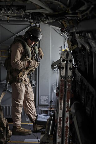 U.S. Marine Corps Cpl. Brian A. Funari, a tiltrotor crew chief with Marine Medium Tiltrotor Squadron (VMM) 365, conducts pre-flights check on an MV-22B Osprey before parachute exercises at Marine Corps Air Station New River, N.C., Sept. 1, 2015. VMM-365 transported Marines assigned to Marine Raider Regiment as they conducted the exercises.