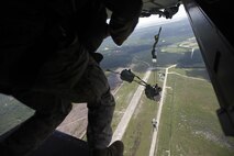 U.S. Marines with Marine Raider Regiment, conduct a static-line jump from an MV-22B Osprey assigned to Marine Medium Tiltrotor Squadron 265 (VMM), during parachute exercises above drop zone Pheasant, N.C., Sept. 1, 2015. VMM-365 transported Marines assigned to Marine Raider Regiment as they conducted the exercises.