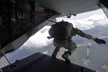 A U.S. Marine with Marine Raider Regiment, conducts a free-fall jump from the back of an MV-22B Osprey assigned to Marine Medium Tiltrotor Squadron 265 (VMM), during parachute exercises above drop zone Pheasant, N.C., Sept. 1, 2015. VMM-365 transported Marines assigned to Marine Raider Regiment as they conducted the exercises.