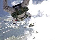 U.S. Marines with Marine Raider Regiment, conduct a free-fall jump from the back of an MV-22B Osprey assigned to Marine Medium Tiltrotor Squadron 265 (VMM), during parachute exercises above drop zone Pheasant, N.C., Sept. 1, 2015. VMM-365 transported Marines assigned to Marine Raider Regiment as they conducted the exercises.