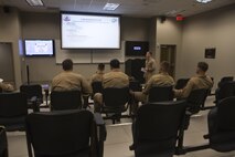 U.S. Marine Corps Capt. Edward C. Proulx, an MV-22B Osprey pilot with Marine Medium Tiltrotor Squadron (VMM) 365, delivers a brief on Marine Corps Air Station New River, N.C., Sept. 2, 2015. VMM-365 supported Marine Corps Security Force Regiment, Fleet Antiterrorism Security Team Company, Fifth Platoon, by providing a means of quickly evacuating simulated casualties during a casualty evacuation drill.