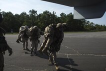 U.S. Marines assigned to Marine Corps Security Force Regiment, Fleet Antiterrorism Security Team (FAST) Company, Fifth Platoon, load simulated casualties into an MV-22B Osprey assigned to Marine Medium Tiltrotor Squadron (VMM) 365, during a casualty evacuation (CASEVAC) drill near Marine Corps Air Station New River, N.C., Sep. 2, 2015. VMM-365 supported FAST Marines by providing a means of quickly evacuating simulated casualties during a CASEVAC drill.