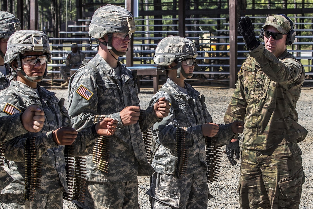 A range cadre, right, assigns lanes to basic combat training soldiers preparing to fire the M249 squad assault weapon and M240 machine gun at the weapons range on Fort Jackson, S.C., Sept. 18, 2015. U.S. Army photo by Sgt. 1st Class Brian Hamilton