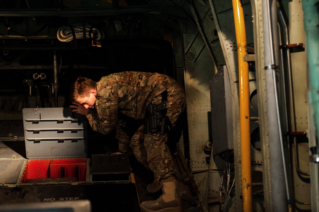 U.S. Air Force Airman 1st Class Chase Krol completes a post-flight inspection on an EC-130H Compass Call aircraft at Bagram Air Field, Afghanistan, Sept. 6, 2015. Krol is an airborne maintenance technician assigned to the 41st Expeditionary Electronic Combat Squadron. U.S. Air Force photo by Tech. Sgt. Joseph Swafford