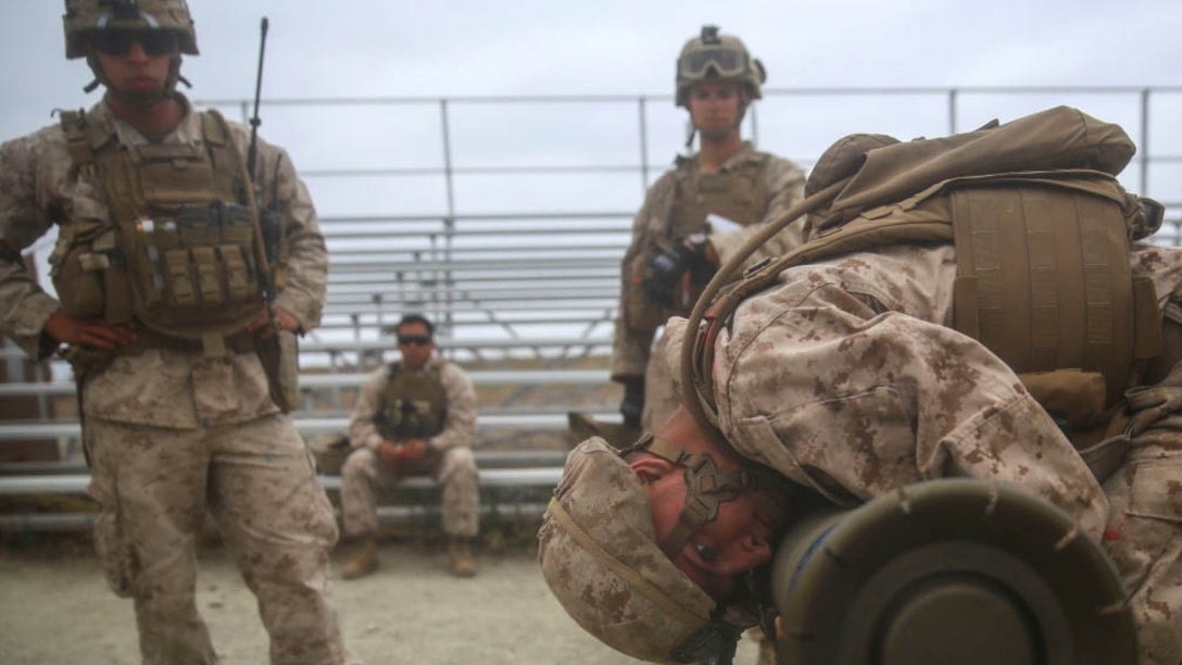 An anti-tank missileman with Combined Anti-Armor Team (CAAT) Red within Battalion Landing Team (BLT) 2/1, the ground combat element for the 13th Marine Expeditionary Unit, perfoms pre-fire inspections on a Tube-launched, Optically-tracked, Wire-guided (TOW) Missile before he and fellow Marines practice hunter-killer techniques on Aug. 21, 2015. The CAAT, composed of heavy machine gunners and anti-tank missilemen, is used to combat hardened targets as well as provide security. 