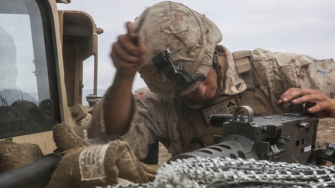 Lance Cpl. Jay Singh, a U.S. Marine with the Combined Anti-Armor Team (CAAT) within Battalion Landing Team (BLT) 2/1, the ground combat element for the 13th Marine Expeditionary Unit, performs maintenance on an M2 .50-Caliber machine gun during training on Aug. 21, 2015. The CAAT, composed of heavy machine gunners and anti-tank missilemen, is used to combat hardened targets as well as provide security. 