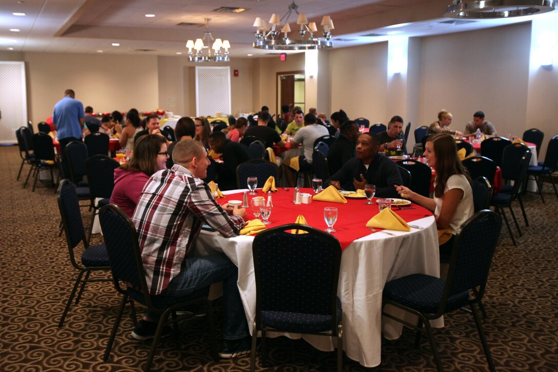 Couples gather for breakfast during a Marriage Enrichment Retreat, hosted by 2nd Marine Aircraft Wing Chaplains in New Bern, N.C., Sept. 19, 2015. Forty couples took part in the two-day retreat to rekindle their bond with one another. Each couple participated in prescribed ice-breaking conversation techniques, seminars on communication and other couple-related cohesion-building activities. (U.S. Marine Corps photo by Lance Cpl. Jason Jimenez/Released)