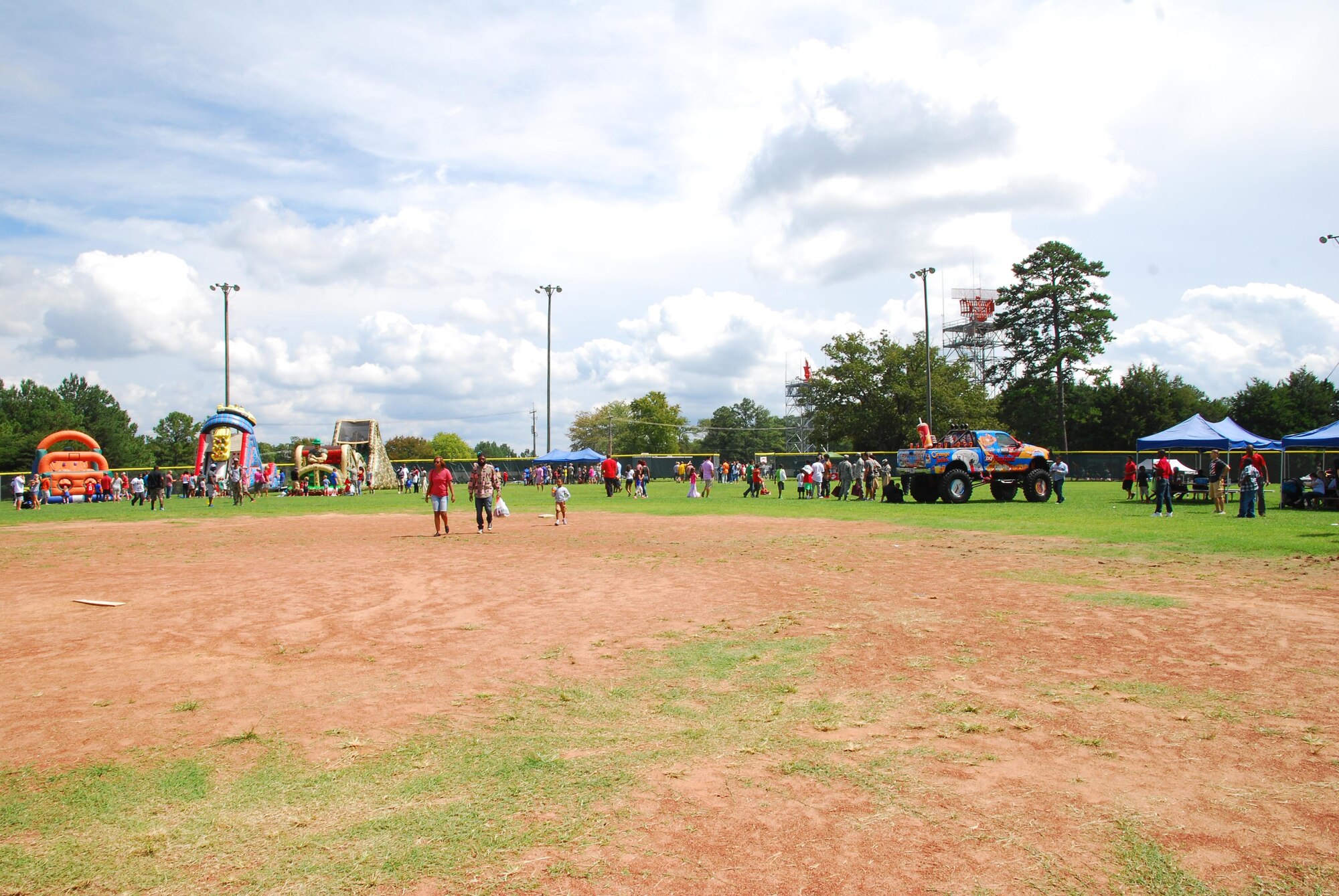 94th Airlift Wing family members participate in the 2015 Wing Family Day Sept. 12, 2015 at the Dobbins Lakeside Recreation Area at Dobbins Air Reserve Base, Ga. Attendees enjoyed music, food, dunking booths, exhibits, vendors, auctions, jump castles, face painting, pet adoption and raffles. (U.S. Air Force photo/Staff Sgt. Jaclyn McDonald)