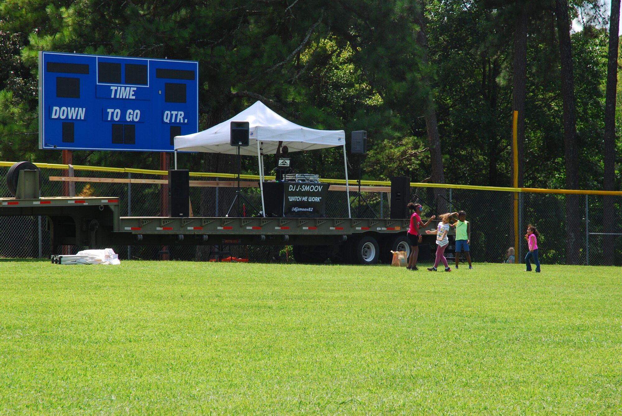 Children of 94th Airlift Wing members dance to the music playing courtesy of DJ Smoov at the 2015 Wing Family Day Sept. 12, 2015 at the Lakeside Recreation Area at Dobbins Air Reserve Base, Ga.. Attendees enjoyed music, food, dunking booths, exhibits, vendors, auctions, jump castles, face painting, pet adoption and raffles. (U.S. Air Force photo/Staff Sgt. Jaclyn McDonald)