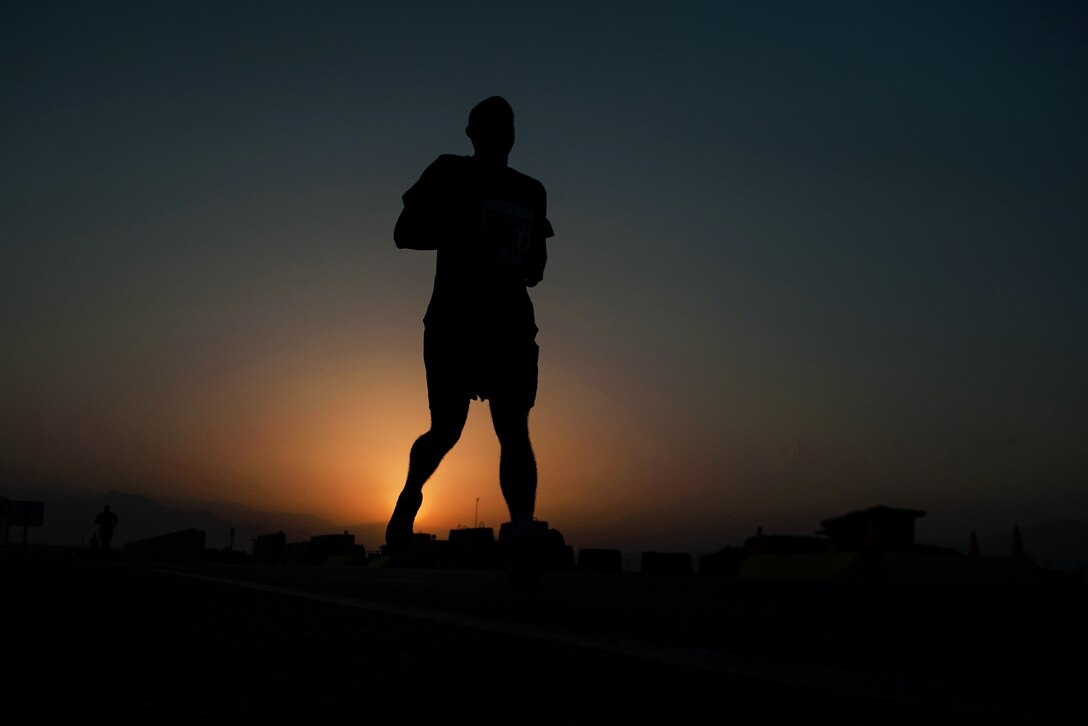 A U.S. service member runs during the Air Force Marathon and Air Force Half Marathon on Bagram Airfield, Afghanistan, Sept. 19, 2015. U.S. Air Force photo by Tech. Sgt. Joseph Swafford