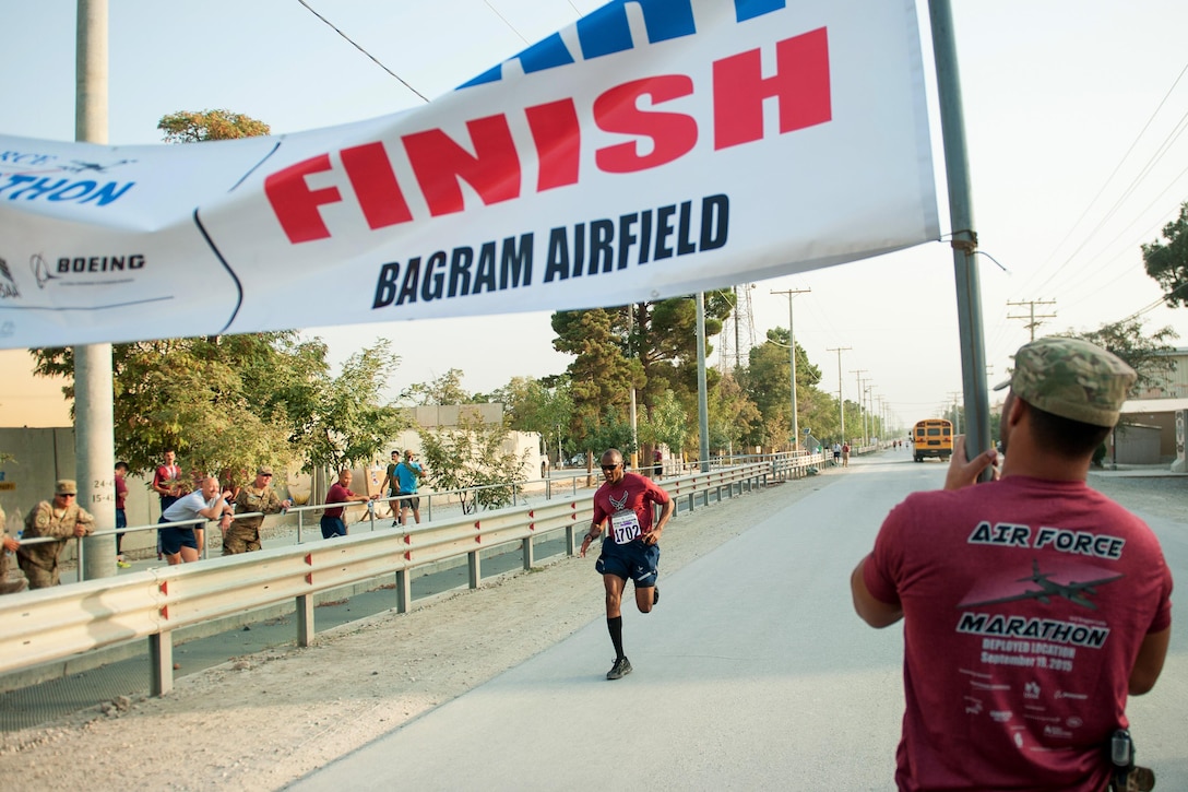 A U.S. airman approaches the finish line during the Air Force Half Marathon on Bagram Airfield, Afghanistan, Sept. 19, 2015. U.S. Air Force photo by Tech. Sgt. Joseph Swafford