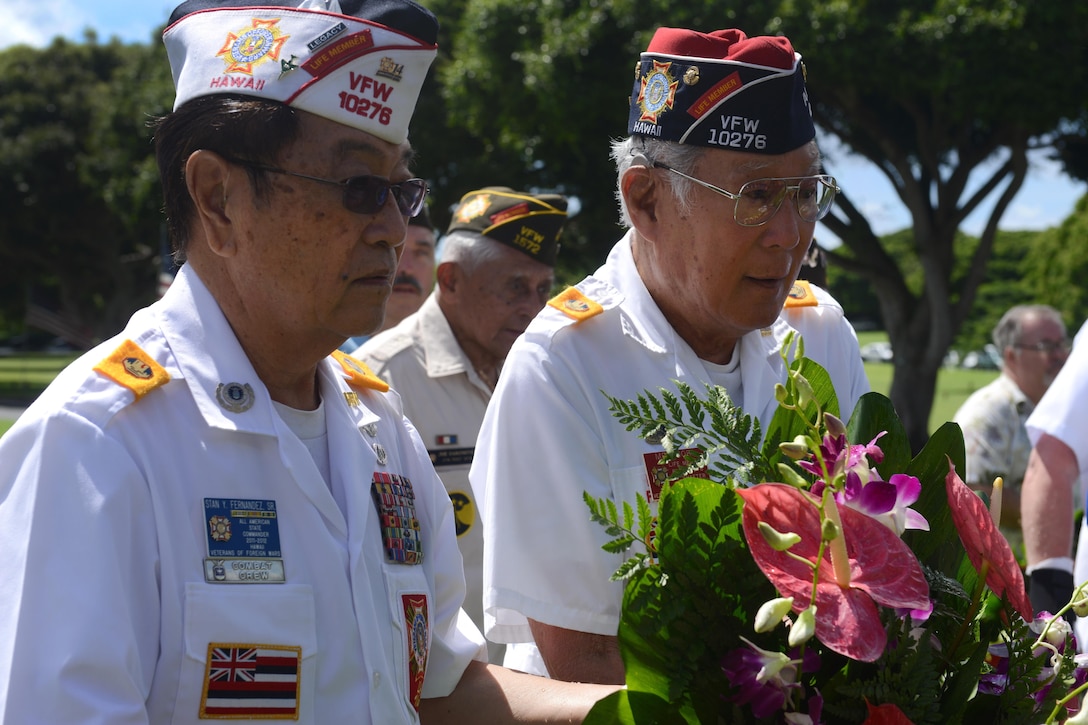 Members of Veterans of Foreign Wars Post No. 10276 present a wreath during the National Prisoner of War/Missing in Action Recognition Day ceremony at the National Memorial Cemetery of the Pacific in Honolulu, Sept. 18, 2015. National POW/MIA Recognition Day serves as a day for the nation to reaffirm its commitment to recovering its missing and bringing them home. U.S. Army photo by Sgt. Richard DeWitt 