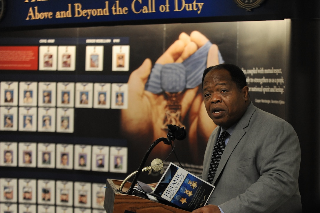 Clarence Johnson, director of the Defense Department's Office of Diversity Management and Equal Opportunity, offers opening remarks during the Hispanic Medal of Honor ribbon-cutting ceremony at the Pentagon, Sept. 18, 2015. DoD photo by Marvin Lynchard