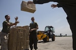 U.S. Service members with the Joint Task Force 505 prepare boxes of aid and relief supplies to be loaded onto an aircraft at Tribhuvan International Airport, Kathmandu, Nepal, May 14, in order for the supplies to be delivered to remote locations during Operation Sahayogi Haat. JTF 505 along with other multinational forces and humanitarian relief organizations are currently in Nepal providing aid after a 7.8 magnitude earthquake struck the country, April 25 and a 7.3 earthquake on May 12. At Nepal’s request the U.S. government ordered JTF 505 to provide unique capabilities to assist Nepal. (U.S. Marine Corps photo by MCIPAC Combat Camera Staff Sgt. Jeffrey D. Anderson/Released)