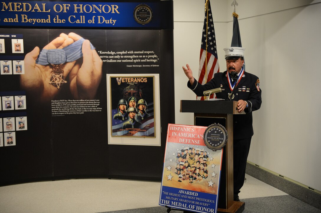Joe Torrillo, a Legacy of Valor Medal of Merit recipient, offers remarks during the Hispanic Medal of Honor ribbon-cutting ceremony at the Pentagon, Sept. 18, 2015. The exhibit pays tribute to Hispanic Medal of Honor recipients from the Civil War to present. Torrillo also is a lieutenant from New York City's Fire Department and member of  the World Memorial 9/11 board of directors. DoD photo by Marvin Lynchard