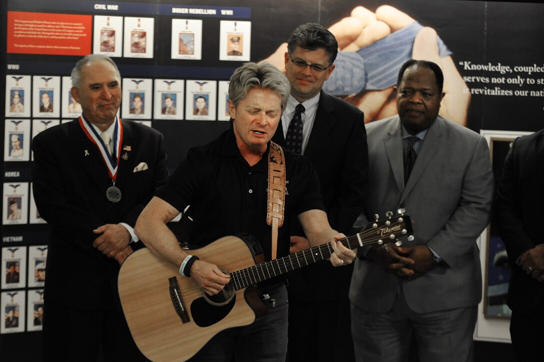 Musician Jeff Senour performs "You Won't be Forgotten" during the ribbon-cutting ceremony for a new display at the Pentagon, Sept. 18, 2015. The temporary display honors Hispanic Medal of Honor recipients from the Civil War to the present. DoD photo by Marvin Lynchard
