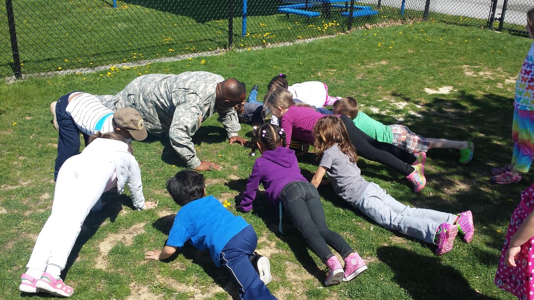 DLA Distribution commander Army Brig. Gen. Richard Dix holds a special “PT” session with children of the Defense Distribution Center Susquehanna’s Child Development Center on April 29.