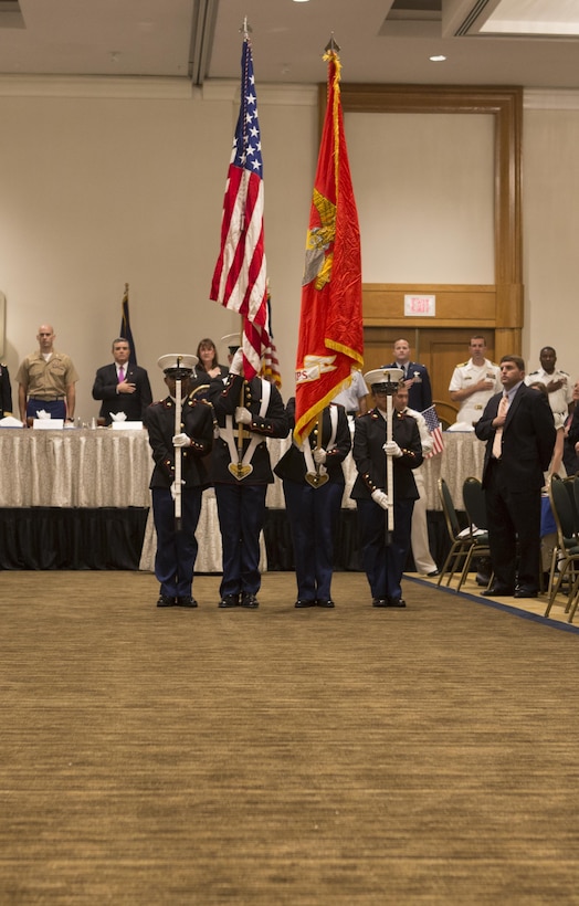 Members of a color guard from the New Orleans Military and Maritime Academy present the colors at Military Appreciation Day 2015 in New Orleans, Sept. 18, 2015. The event was hosted by the Greater New Orleans Council of the Navy League of the United States to recognize the contributions of service members stationed in the New Orleans area. (U.S. Marine Corps photo by Cpl. Ian Leones/Released)
