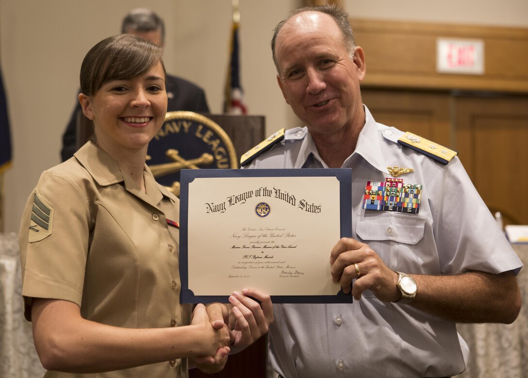 Rear Admiral David Callahan, commander of Eight Coast Guard 
District, (right), presents a Marine of the Year certificate to Sgt. Brytani 
M. Musick, broadcast and media chief with the Marine Forces Reserve public 
affairs office during Military Appreciation Day 2015 in New Orleans, Sept. 18, 
2015.  The event was hosted by the Greater New Orleans Council of the Navy 
League of the United States to recognize the contributions of service members 
stationed in the New Orleans area.  Musick was nominated for the award by the 
Headquarters Battalion Commanding Officer Col. Steven G. Godinho. (U.S. Marine 
Corps photo by Cpl. Ian Leones/Released)