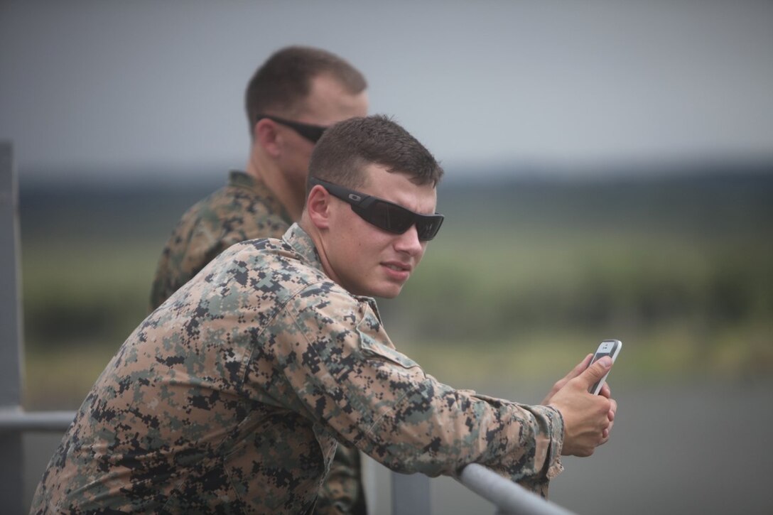 Sgt. Michael E. Gammeri, chief radio operator for KOA MOANA 15-3, stands aboard the USNS Lewis and Clark as it departs Charleston, S.C., Sept. 4. Gammeri, a native of Burlington, Ill., is participating in a three-month deployment which features stops in Tahiti, Fiji, Vanuatu, Kiribati and Timor Leste.