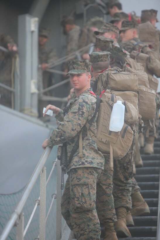 Marines from Koa Moana 15-3 embark the USNS Lewis and Clark in Charleston, S.C., Sept. 1. The Marines recently departed for a three month deployment across the Oceania Region, Sept. 4.