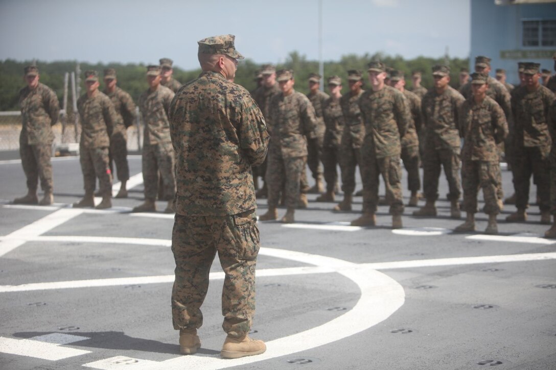 Lt. Col. Demetrius Bolduc, commanding officer of Koa Moana 15-3, speaks to the Marines before departing Charleston, S.C., Sept. 4, for a three month deployment. Marines will be training with military and law enforcement from Tahiti, Fiji, Vanuatu, Kiribati and Timor Leste
