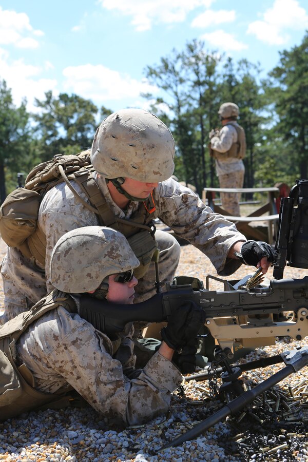 Marines from Battery M, 3rd Battalion,14th Marine Regiment, 4th Marine Division, reload the M240 machine gun range at Pelham Range in Anniston, Alabama, on Sept. 19, 2015. The Marines attended training to hone skills and increase their proficiency in crew-served weapons systems including the M249 SAW and M250.  