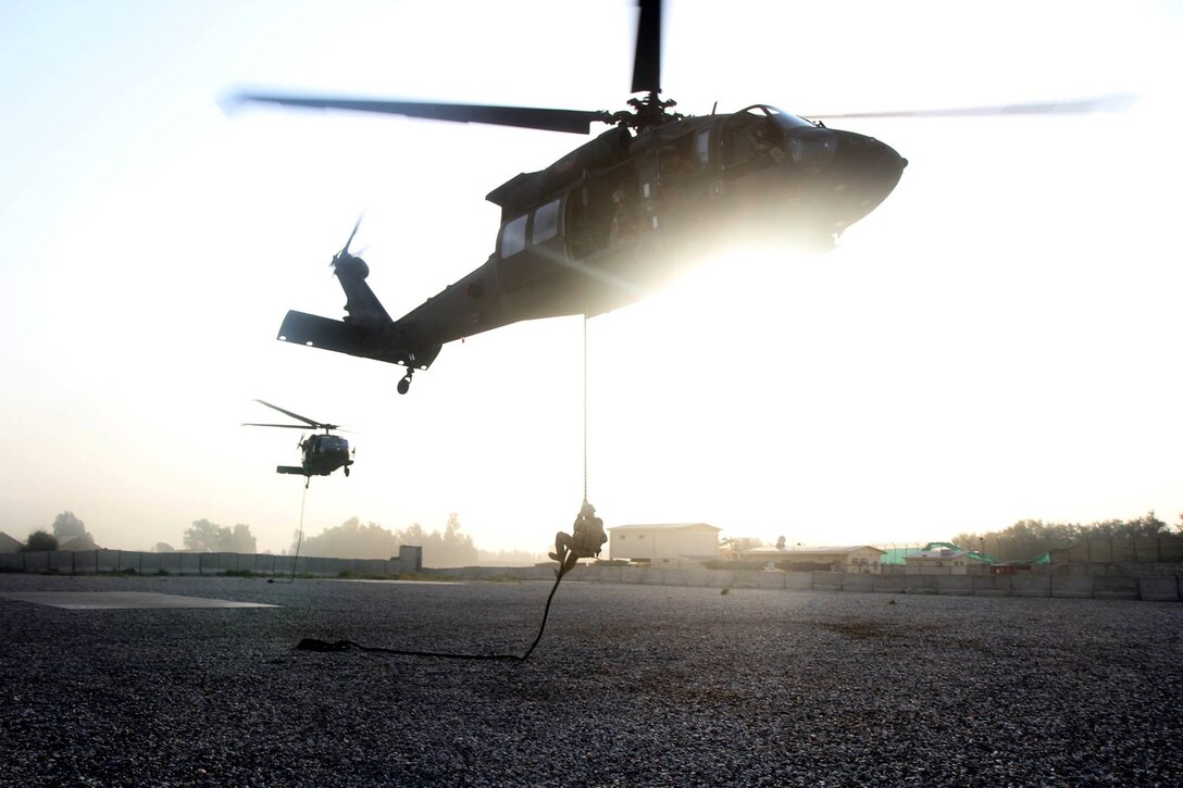 U.S. soldiers fast-rope from UH-60 Black Hawk helicopters during air assault training at Jalalabad Airfield in eastern Afghanistan, Sept. 16, 2015. The soldiers are assigned to the 101st Airborne Division's 3rd Brigade Combat Team. U.S. Army photo by Capt. Charles Emmons 