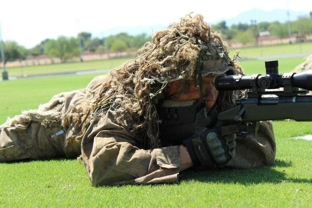 A reconnaissance Marine lies perfectly still for the duration of a narrative that portrays a mock scenario, Sept. 11, 2015. A Marine Air Ground Task Force demonstration at the Arizona State University stadium gave the local community a chance to witness multiple aspects of the Corps’ capabilities.