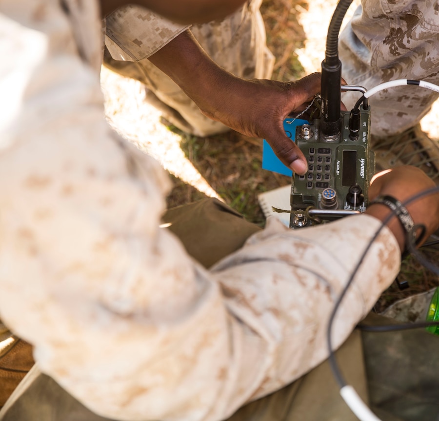 A Marine with 10th Marine Regiment, 2nd Marine Division works on a radio during Operation Firestorm, a week-long field exercise to prepare the regiment for their upcoming exercise, Rolling Thunder, at Camp Lejeune, N.C., Aug. 15, 2015. “The main focus for Operation Firestorm is to get the regiment out into the field and knock the dirt off the gear, get all of the communications checks and operations checks and make sure that we’re ready for Rolling Thunder coming up next month,” said Master Sgt. Justin Mingie, logistics chief for 10th Marines. (U.S. Marine Corps photo by Cpl. Krista James/Released)


